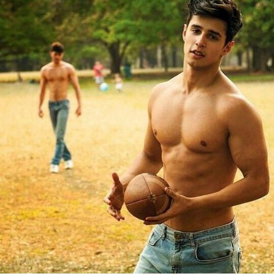 This image has an empty alt attribute; its file name is shirtless-college-boys-with-football.jpg